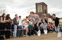 BERLIN, GERMANY - JULY 21: Contestants compete in the Cloth Tote Sack Race during the second annual Hipster Olympics on July 21, 2012 in Berlin, Germany. With events such as the "Horn-Rimmed Glasses Throw," "Skinny Jeans Tug-O-War," "Vinyl Record Spinning Contest" and "Cloth Tote Sack Race," the Hipster Olympics both mocks and celebrates the Hipster subculture, which some critics claim could never be accurately defined and others that it never existed in the first place. The imprecise nature of determining what makes one a member means that the symptomatic elements of adherants to the group vary in each country, but the archetype of the version in Berlin, one of the more popular locations for those following its lifestyle, along with London and Brooklyn, includes a penchant for canvas tote bags, the carbonated yerba mate drink Club Mate, analogue film cameras, asymmetrical haircuts, 80s neon fashion, and, allegedly, a heavy dose of irony. To some in Berlin, members of the hipster "movement" have replaced a former unwanted identity in gentrifying neighborhoods, the Yuppie, for targets of criticism, as landlords raise rents in the areas to which they relocate, particularly the up-and-coming neighborhood of Neukoelln. (Photo by Adam Berry/Getty Images)