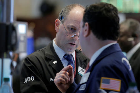 Traders work on the floor of the New York Stock Exchange (NYSE) in New York City, U.S., May 25, 2016. REUTERS/Brendan McDermid