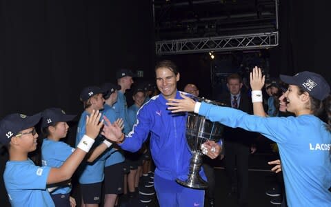 Rafael Nadal and ballboys and girls - Credit: Peter Staples/ATP Tour/Getty Images