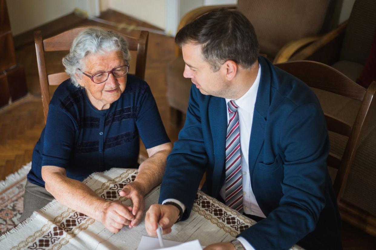 Grandmother looking at the contract