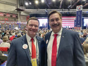 Republican attorney general candidate Doug Wardlow, left, and MyPillow CEO Mike Lindell work the crowd at the Minnesota GOP state convention in Rochester, Minn. on Friday, May 13, 2022. Wardlow is general counsel for MyPillow, while Lindell has risen to national prominence for perpetuating the baseless claim that Trump won the 2020 election. (AP Photo/Steve Karnowski)