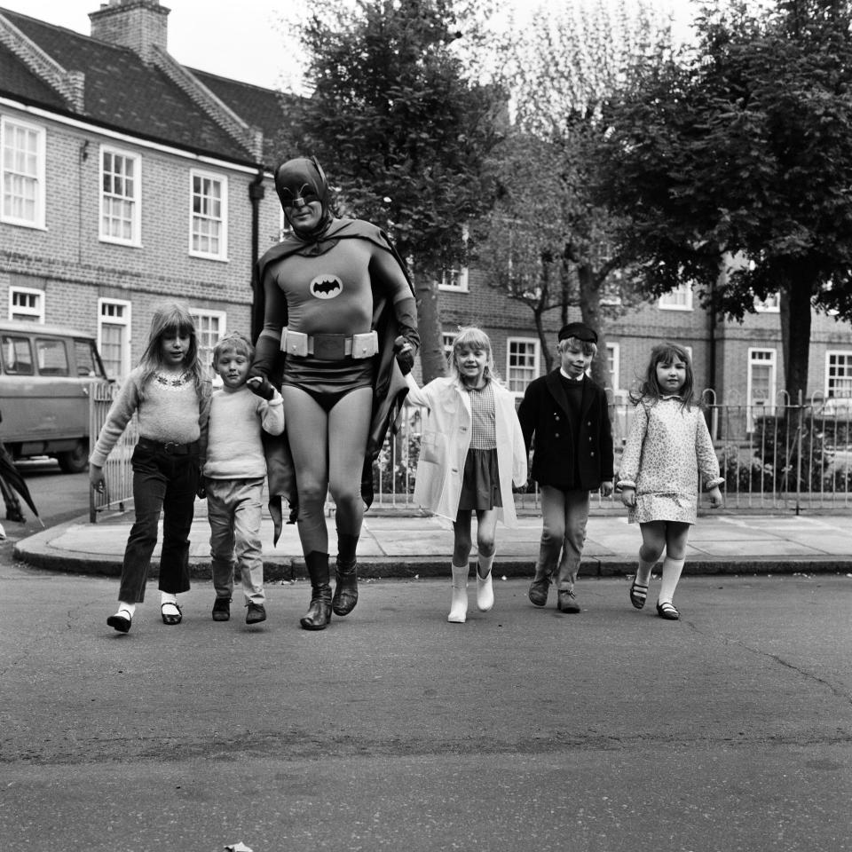 Adam West as Batman helps out with road safety campaign in London which is being sponsored by the Ministry of Transport, 7th May 1967. (Photo by Freddie Cole/Mirrorpix/Getty Images)  - Getty