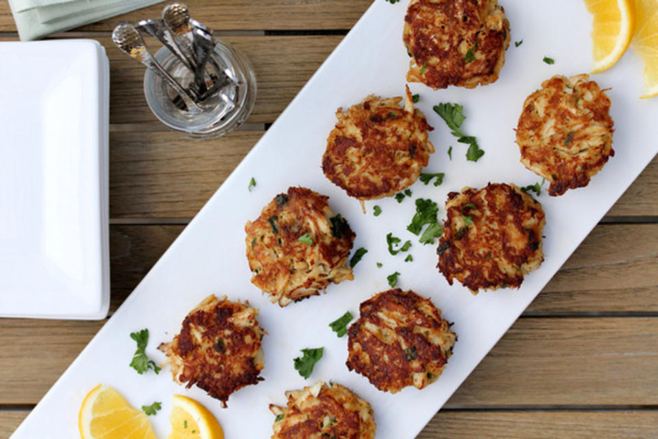 <p>Karen's Kitchen Stories</p><p>These are a wonderful way to add a little seafood to your midnight party. </p><p><strong>Get the recipe: <a href="https://www.karenskitchenstories.com/2014/01/mini-maryland-crab-cakes-appetizerweek.html" rel="nofollow noopener" target="_blank" data-ylk="slk:Mini Crab Cakes;elm:context_link;itc:0;sec:content-canvas" class="link ">Mini Crab Cakes</a></strong></p>