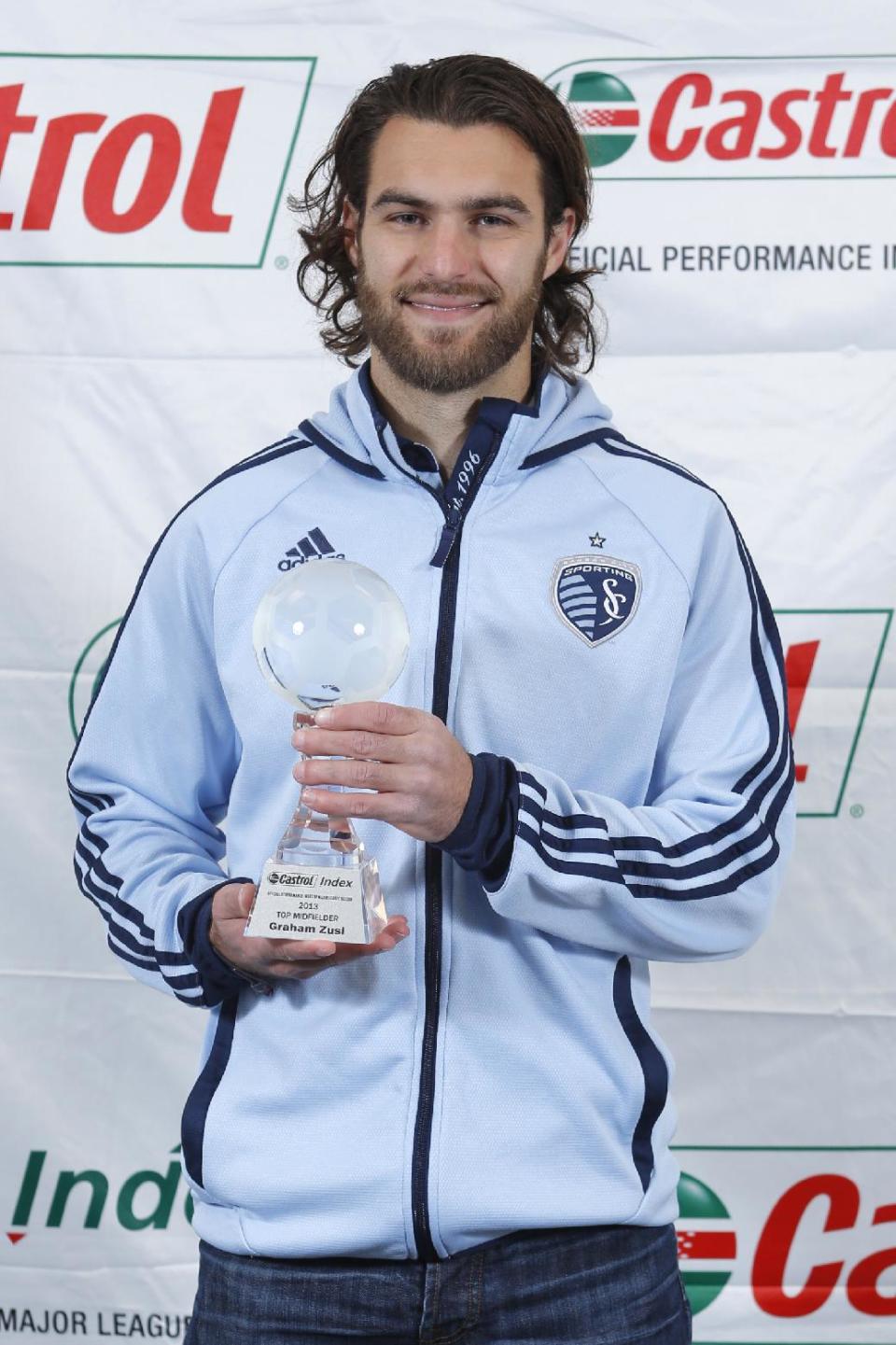 Sporting Kansas City's Graham Zusi accepts the Castrol Index 2013 Top MLS Midfielder Award Friday, Dec. 6, 2013, in Kansas City, Kan. (Ed Zurga/AP Images for Castrol GTX High Mileage)