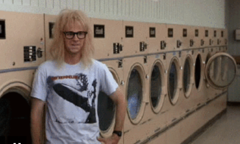 person standing in the laundromat