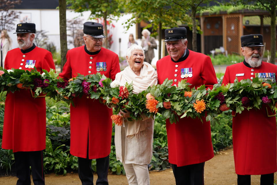 <p>Dame Judi Dench with Chelsea Pensioners during the RHS Chelsea Flower Show press day, at the Royal Hospital Chelsea, London. Picture date: Monday September 20, 2021.</p>
