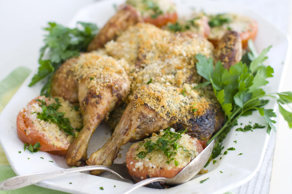 In this image taken on April 2, 2012, a platter of Elizabeth Karmel's "French Chicken," chicken slathered with mustard, white wine, and scallion sauce that bakes during roasting, is seen in Concord, N.H. (AP Photo/Matthew Mead)