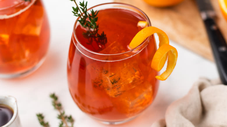 Cranberry cocktail with orange twist garnish