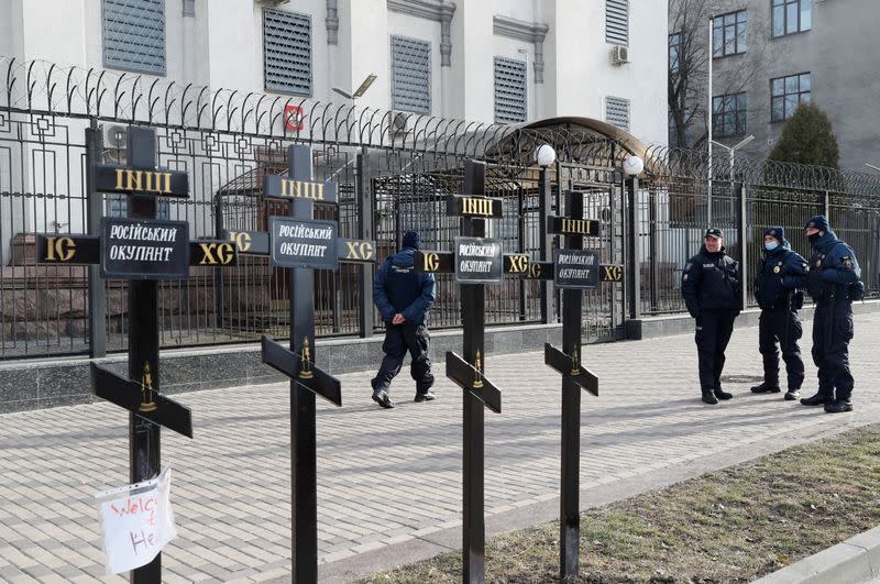 Crosses installed during a protest against Russia's actions in Donbas are seen in front of the Russian embassy Kyiv