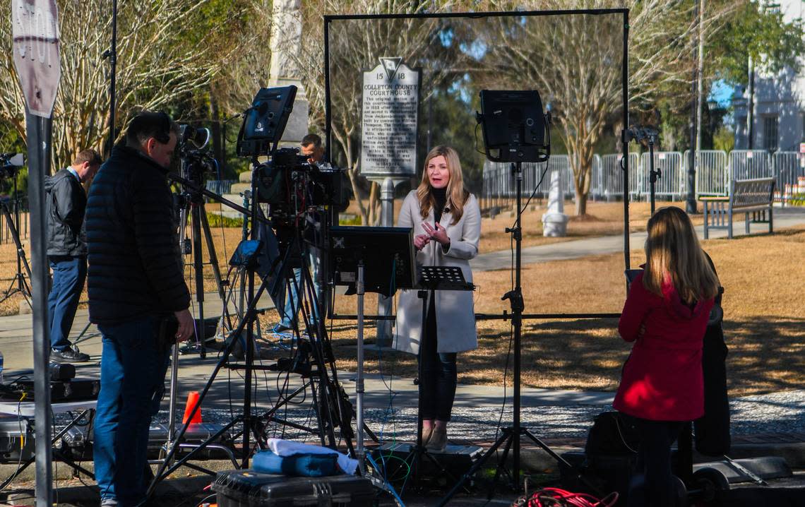 A television reporter goes on the air at the Colleton County Courthouse on Monday Jan. 23, 2023 during jury selection for Alex Murdaugh who is charged with the murder of his wife Maggie Murdaugh and son Paul Murdaugh in Walterboro, S.C.