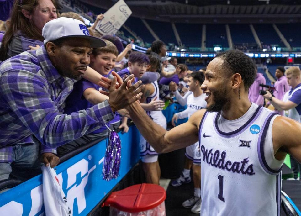 Kansas State’s Markquis Nowell celebrates with fans after the Wildcats secured a spot in the Sweet 16 on Sunday with a win over Kentucky.