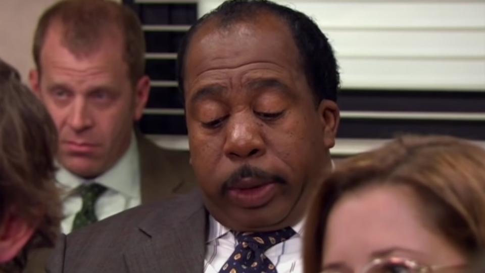 Stanley doing his puzzle in a meeting