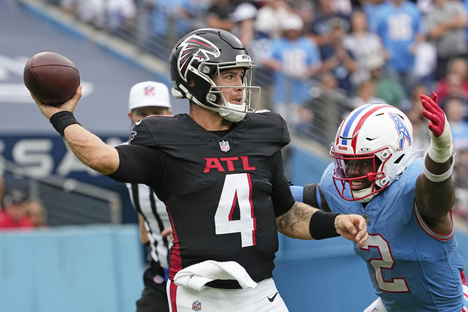 Atlanta Falcons quarterback Taylor Heinicke (4) throws under pressure from Tennessee Titans linebacker Azeez Al-Shaair (2) during the second half of an NFL football game, Sunday, Oct. 29, 2023, in Nashville, Tenn. (AP Photo/George Walker IV)