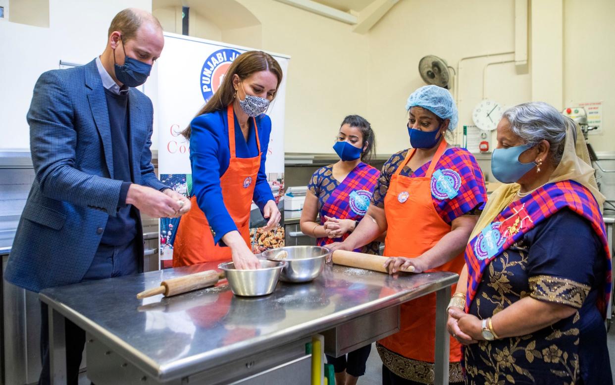 The Duke and Duchess of Cambridge help prepare meals with representatives of Sikh Sanjog in Edinburgh - Jane Barlow/PA Wire