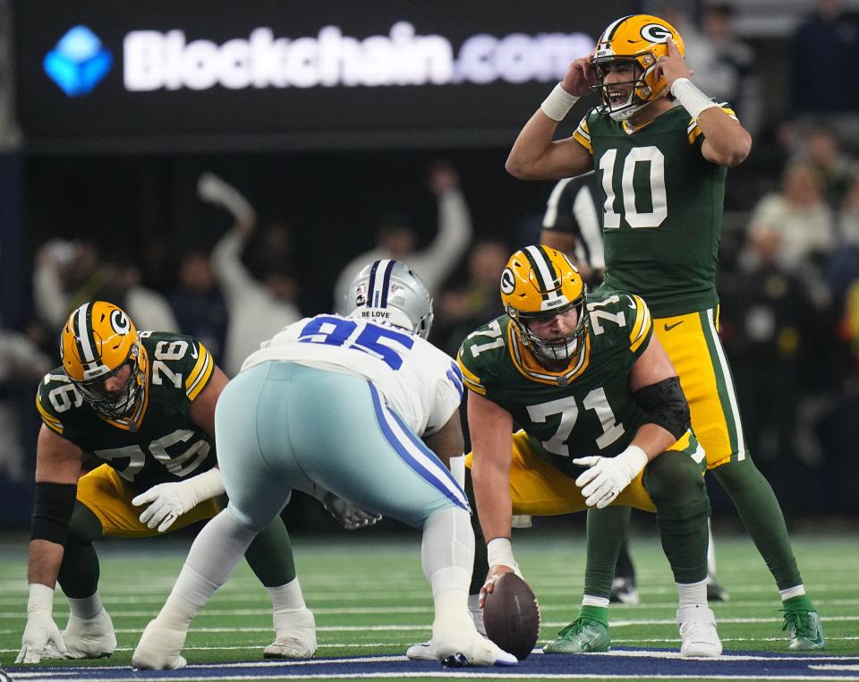 Green Bay Packers quarterback Jordan Love (10) makes an adjustment on the line during the first quarter of the wild card playoff game Sunday, January 14, 2024 at AT&T Stadium in Arlington, Texas. The Green Bay Packers beat the Dallas Cowboys 48-32.