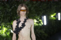 A model wears a creation as part of the Palm Angels men's Spring-Summer 2020 collection, unveiled during the fashion week, in Milan, Italy, Sunday, June 16, 2019. (AP Photo/Luca Bruno)