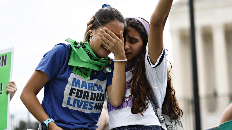 Abortion rights demonstrators react outside the US Supreme Court in Washington, D.C., US, on Friday, June 24, 2022. A deeply divided Supreme Court overturned the 1973 Roe v. Wade decision and wiped out the constitutional right to abortion, issuing a historic ruling likely to render the procedure largely illegal in half the country. Photographer: Ting Shen/Bloomberg via Getty Images