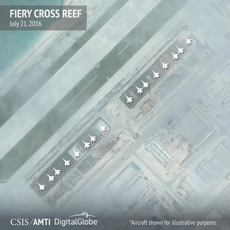 Aircraft hangars that, according to the Center for Strategic and International Studies (CSIS), have room for any fighter jet in the Chinese air force are seen on Fiery Cross Reef in the Spratly islands, in the disputed South China Sea in this July 21, 2016 satellite image released by the Asian Maritime Transparency Initiative at CSIS to Reuters on August 9, 2016. Aircrafts added at source for illustrative purposes. CSIS Asia Maritime Transparency Initiative/DigitalGlobe/Handout via REUTERS