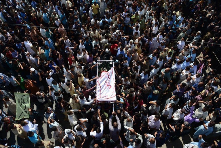 Pakistani Shiites carry a coffin during the funeral procession of bomb blast victims in Karachi, on March 4, 2013. Thousands of Pakistanis have attended funerals for victims of a bombing that killed 48 people in a Shiite Muslim area of Karachi, the latest in a series of devastating attacks ahead of elections