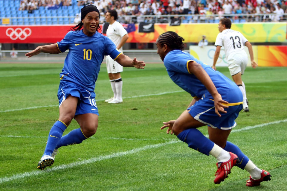 SHENYANG, CHINA - AUGUST 10: Ronaldinho (L) of Brazil celebrates with team mate Anderson, who scored the first goal, during the Men's First Round Group C match between New Zealand and Brazil in Shenyang Olympic Stadium on Day 2 of the Beijing 2008 Olympic Games on August 10, 2008 in Shenyang, China. (Photo by Lars Baron/Bongarts/Getty Images)