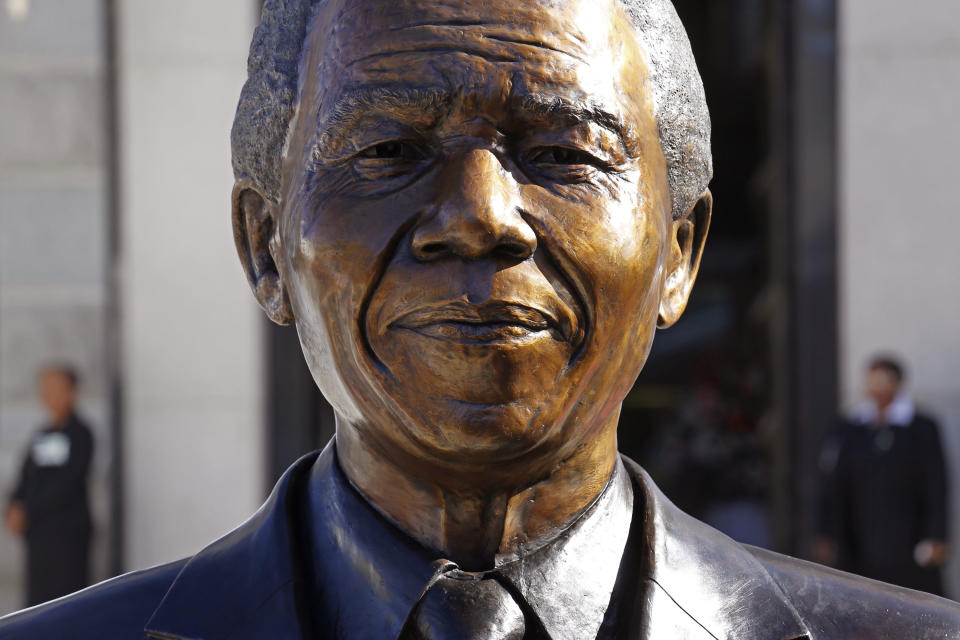 A bust of former South African President Nelson Mandela after it's unveiling by dignitaries at the South African Parliament in Cape Town, South Africa, Monday, April 28, 2014. South African President Jacob Zuma and members of the South African Parliament unveiled the bust of Mandela at Parliament, forming part of celebrations for 20-years anniversary of a democratic Parliament in South Africa after the end of white rule. (AP Photo/Schalk van Zuydam)