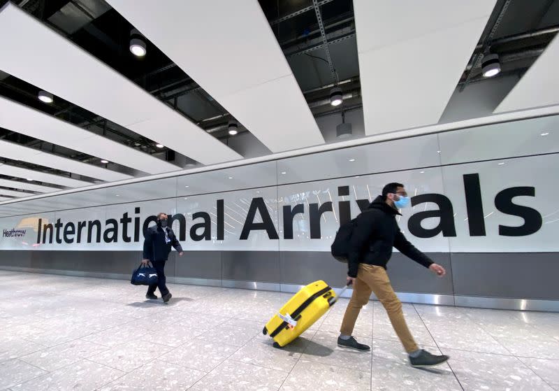 FILE PHOTO: Travellers at Heathrow Airport