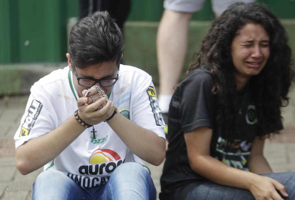 <p>Supporters of Brazil’s soccer team Chapecoense mourn outside the Arena Conda stadium in Chapeco, Brazil, Tuesday, Nov. 29, 2016. A chartered plane that was carrying the Brazilian soccer team to the biggest match of its history crashed into a Colombian hillside and broke into pieces, killing 75 people and leaving six survivors, Colombian officials said Tuesday. (AP Photo/Andre Penner) </p>