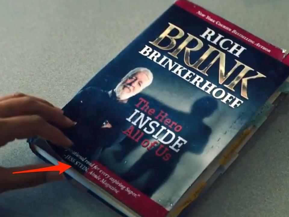 A red arrow pointing to a quote on a book cover on season one, episode one of "Gen V."