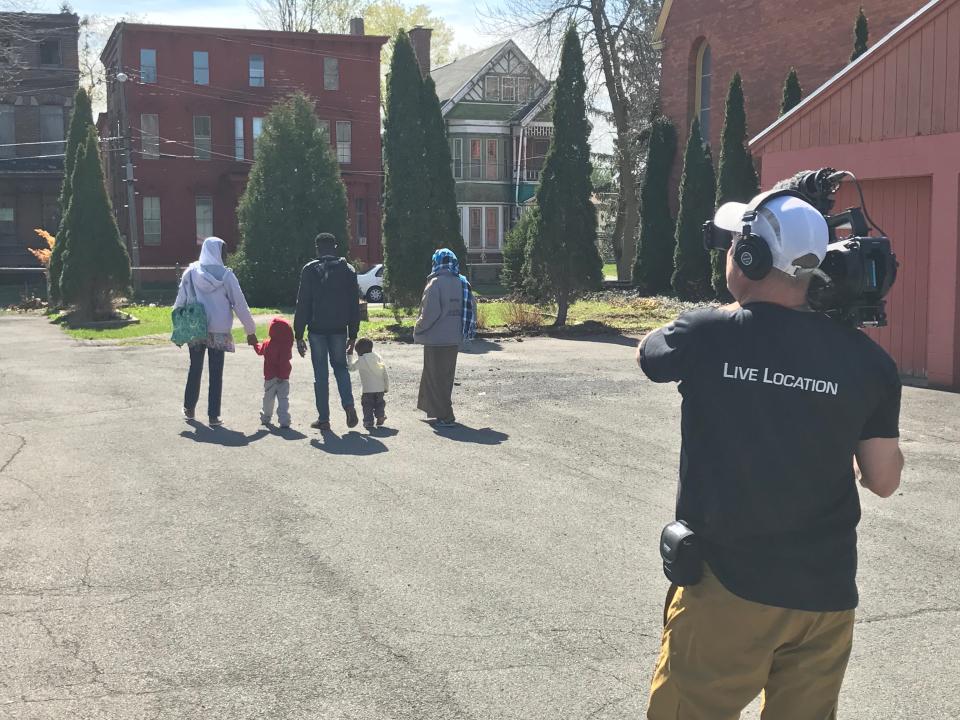 The Azein family, who came to the U.S. as refugees from Sudan, are seen walking home from a refugee center in Utica, NY with their friend Sefat (far left), as director Loch Phillipps shoots footage for "Utica: The Last Refuge" in 2017. The documentary film will be shown for free at the Zeiterion Performing Arts Center in New Bedford on Tuesday, June 13, at 7 p.m. followed by a panel discussion.