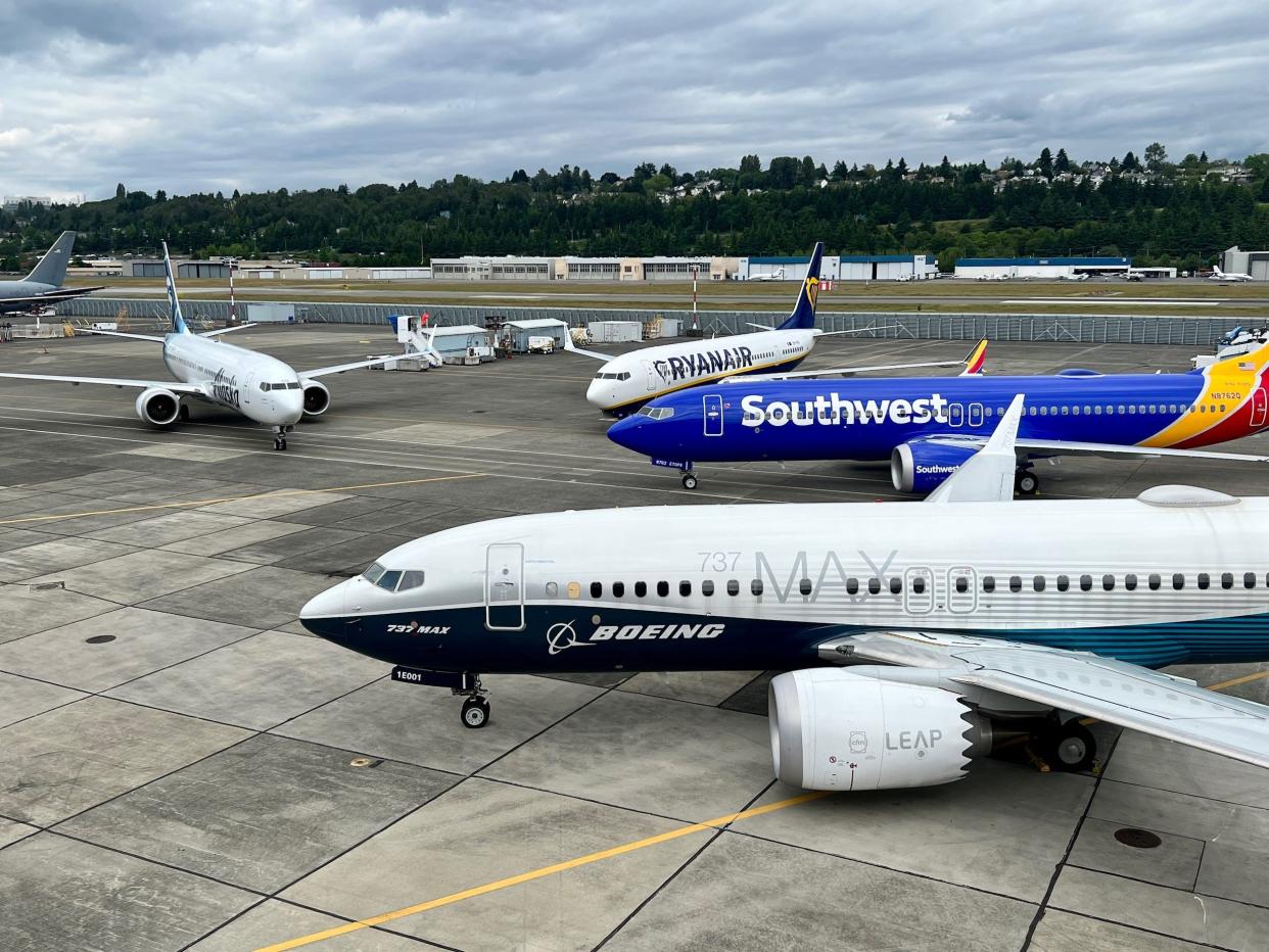 Boeing 737 MAX 7 in Boeing livery. A Southwest 737 MAX 8, a Ryanair 737 MAX 8200, and an Alaska 737 MAX 9 sit behind.