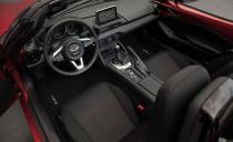 <p>Living under the MX-5's long hood is a 2.0-liter inline-four making 155 horsepower. Thanks to the Miata's feather weight, that power is enough to make the ND <a rel="nofollow noopener" href="https://www.caranddriver.com/reviews/a15080595/2016-mazda-mx-5-miata-long-term-test-review" target="_blank" data-ylk="slk:the quickest Miata yet;elm:context_link;itc:0;sec:content-canvas" class="link ">the quickest Miata yet</a>-it's quicker than even the turbocharged (more powerful) NB-generation Mazdaspeed Miata. Behind the engine sits a six-speed manual transmission (a six-speed automatic is optional) and a cozy cabin stripped of all frippery. Only the basics are there: a steering wheel, gauges, knobs for the climate controls, and a screen perched above the dashboard for displaying infotainment functions. Base models get an old-school audio head unit in place of the screen<br></p>