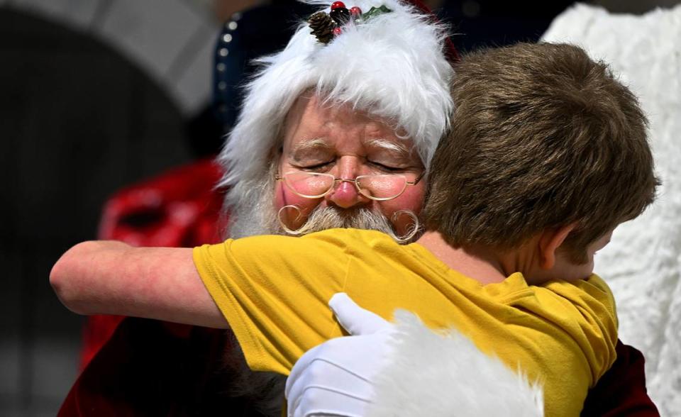 Santa gets a big hug from a child at the 38th annual Flight to the North Pole program for children with disabilities and terminal illnesses at Feld Entertainment in Palmetto.