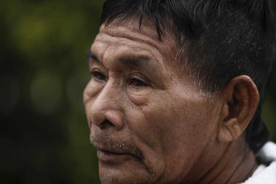 Narciso Mucutuy, the grandfather of the 4 rescued Indigenous children, speaks to the media from the entrance of the military hospital where the children who survived an Amazon plane crash that killed three adults and then braved the jungle for 40 days before being found alive, are receiving medical attention, in Bogota, Colombia, Sunday, June 11, 2023. (AP Photo/Ivan Valencia)