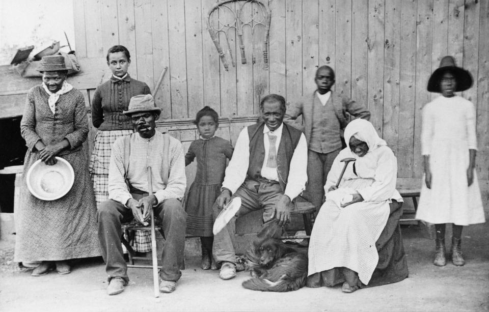 A portrait of abolitionist Harriet Tubman with her family in 1887.