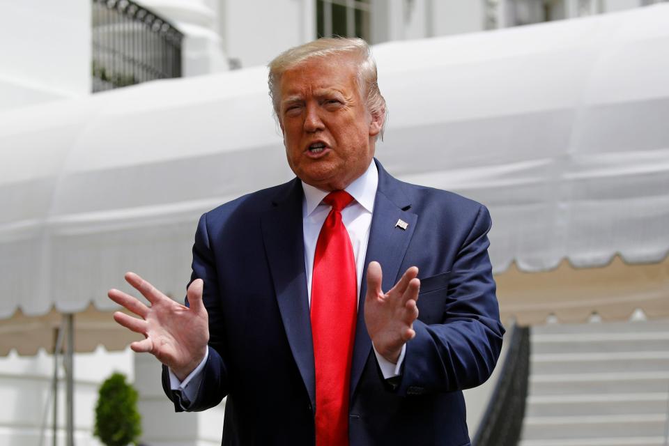 President Donald Trump speaks with members of the press on the South Lawn of the White House, Saturday, May 30, 2020, in Washington, before boarding Marine One for a short trip to Andrews Air Force Base, Md. Trump is en route to Kennedy Space Center for the SpaceX Falcon 9 Launch.