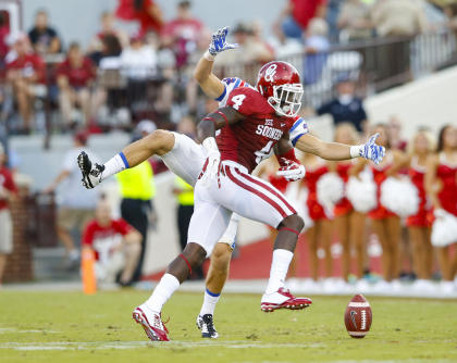 Aug 30, 2014; Norman, OK, USA; Oklahoma Sooners safety Hatari Byrd (4) knocks a pass down in front of Louisiana Tech Bulldogs running back Hunter Lee (back) during the first half at Gaylord Family - Oklahoma Memorial Stadium. (Kevin Jairaj-USA TODAY Sports)