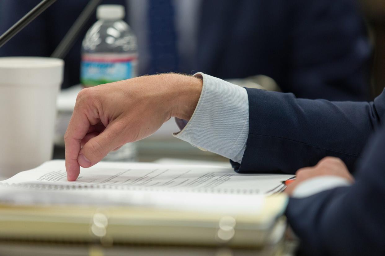 State schools Superintendent Ryan Walters points to a paper before him during an Oklahoma State Board of Education meeting.