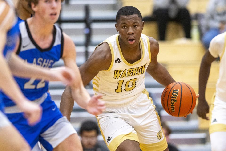 Warren Central High School junior Jevon Guess (10) brings the ball up court during the first half of a Boysâ€™ Marion County Basketball Tournament semi-final game against Franklin Central High School, Friday, Jan. 12, 2024, at Southport High School.