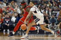 St. John's Dylan Addae-Wusu, left, steals the ball from UConn's Jordan Hawkins, right in the second half of an NCAA college basketball game, Sunday, Jan. 15, 2023, in Hartford, Conn. (AP Photo/Jessica Hill)