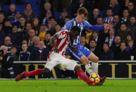 Soccer Football - Premier League - Brighton & Hove Albion vs Stoke City - The American Express Community Stadium, Brighton, Britain - November 20, 2017 Brighton’s Solly March in action with Stoke City's Mame Biram Diouf REUTERS/Hannah McKay