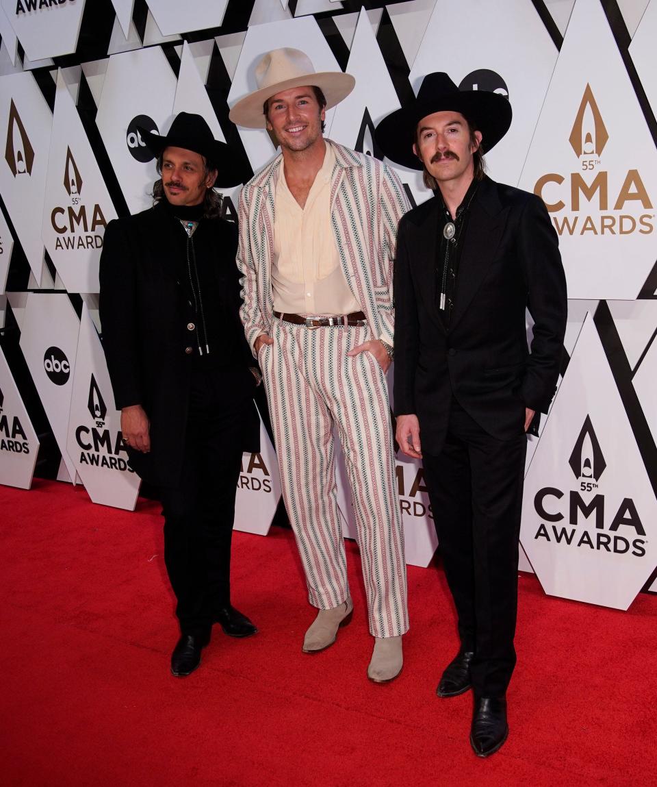 Midland arrives for the 55th CMA Awards at Bridgestone Arena Wednesday, Nov. 10, 2021 in Nashville, Tenn.