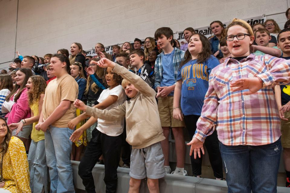 Students at Clinton Elementary School sing a song during a Clinton Elementary School assembly in the gym in Clinton, Tenn. on Thursday, March 28, 2024.