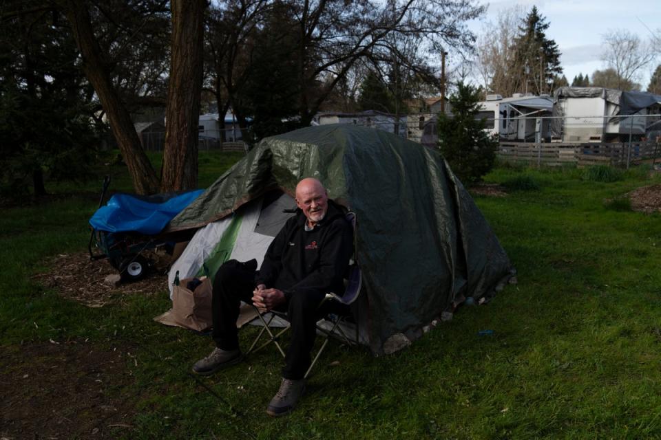 David Wilson sits outside his tent at Riverside Park on Thursday, March 21, in Grants Pass, Oregon. Grants Pass officials argued the laws, enacted in 2013, were created to make it more “uncomfortable” for people to sleep outside after locals raised safety concerns (AP)