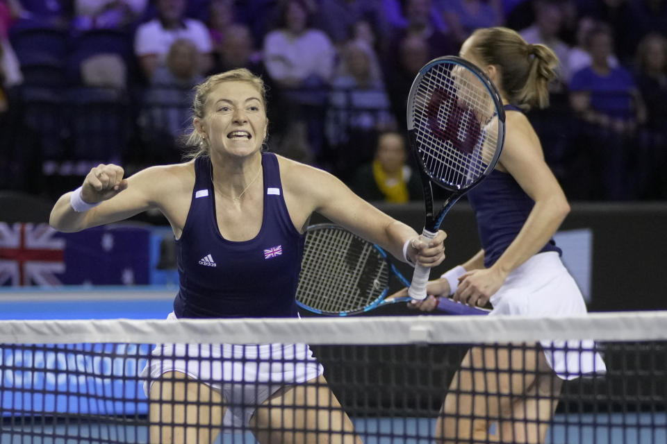 Alicia Barnett, left, and Olivia Nicholls of Great Britain gesture during the semi-final against Storm Sanders and Samantha Stosur of Australia, at the Billie Jean King Cup tennis finals at the Emirates Arena in Glasgow, Scotland, Saturday, Nov. 12, 2022. (AP Photo/Kin Cheung)