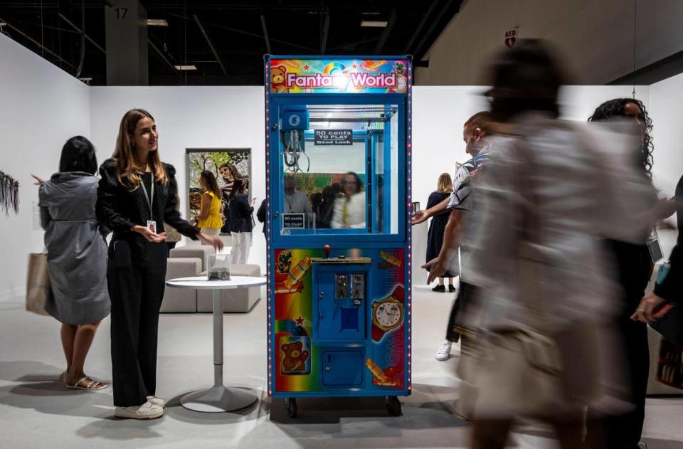 Miami Beach, Florida, December 6, 2023 - A Claw Machine that guests were invited to play with is part of Fantasy World by Artist Anthony Akinbola at Meridians during Art Basel VIP day at the Miami Beach Convention Center.