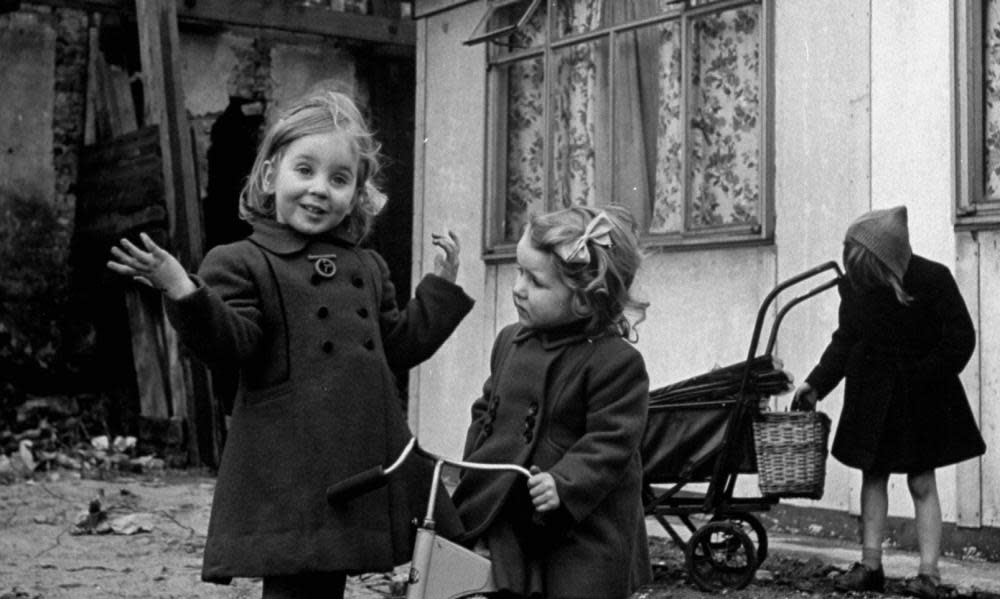 Children in front of a new prefabricated home in 1947.