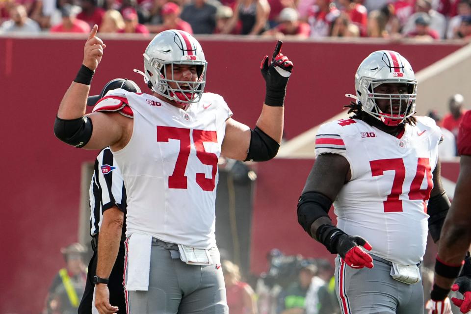 Sep 2, 2023; Bloomington, Indiana, USA; Ohio State Buckeyes offensive lineman Carson Hinzman (75) calls out a play beside Donovan Jackson (74) during the NCAA football game at Indiana University Memorial Stadium. Ohio State won 23-3.