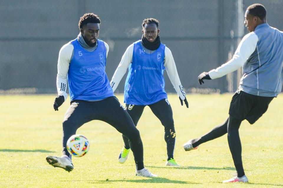 Crew defender Derrick Jones and midfielder Yaw Yeboah work together during preseason training.