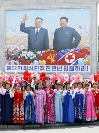 North Korean people greet South Korean President Moon Jae-in and North Korean leader Kim Jong Un during a car parade in Pyongyang, North Korea, September 18, 2018. Pyeongyang Press Corps/Pool via REUTERS