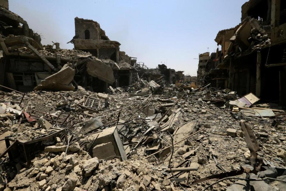 Destroyed buildings from clashes are seen in the Old City of Mosul (Reuters)